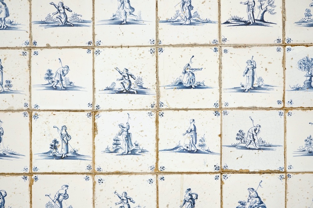A field of 48 Dutch Delft blue and white tiles with shepherds, 17th C.
